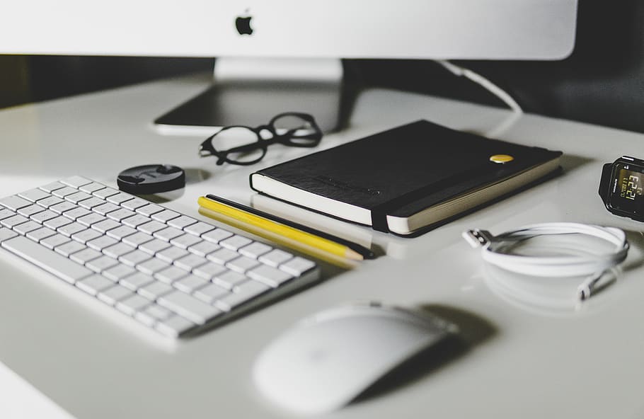 Apple Magic Keyboard and Apple Magic Mouse on white table, shallow focus of Apple magic mouse HD wallpaper