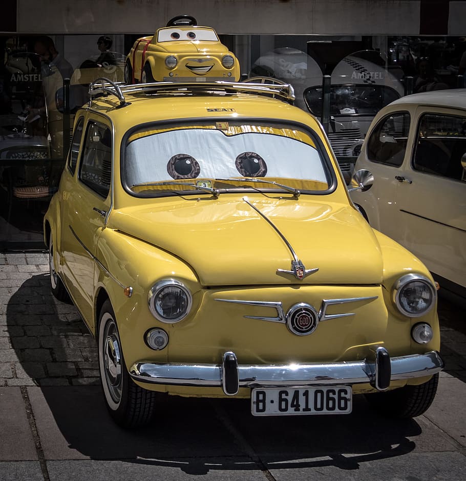 yellow Disney Cars character themed vehicle, Walt Disney, seat 600