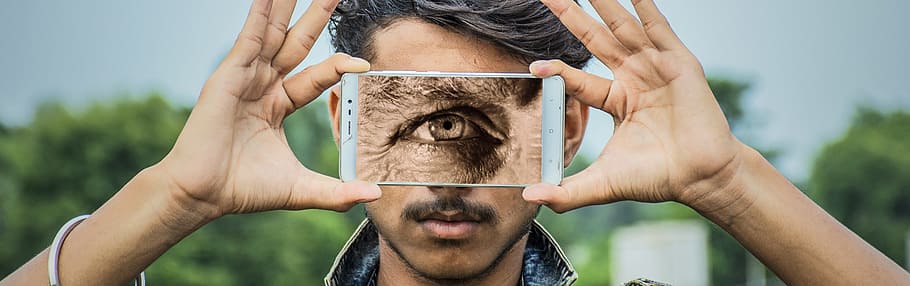 person holding white Android smartphone displaying eye, cyclops, HD wallpaper