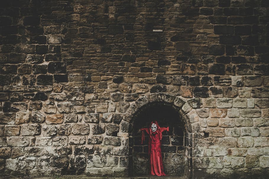 red coat on wall brick, person standing beside brick wall, halloween HD wallpaper