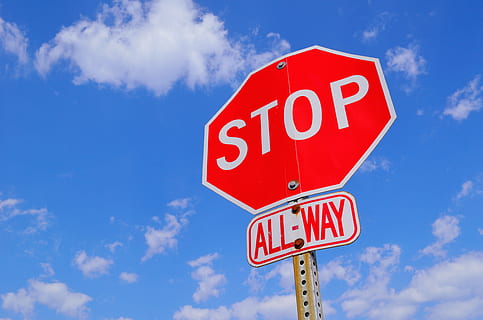 red and white Stop All-Way signage under white clouds during daytime HD wallpaper