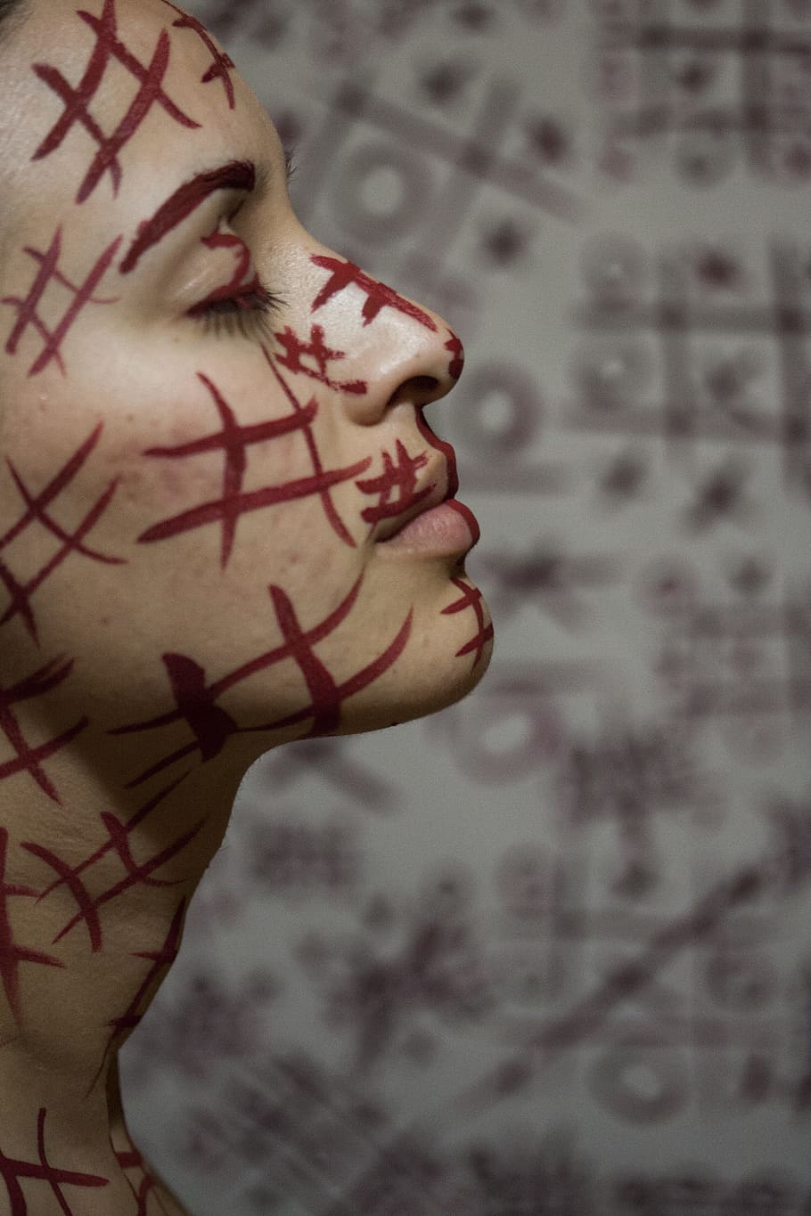 side view photo of woman with tic tac toe line paint, model, fiction