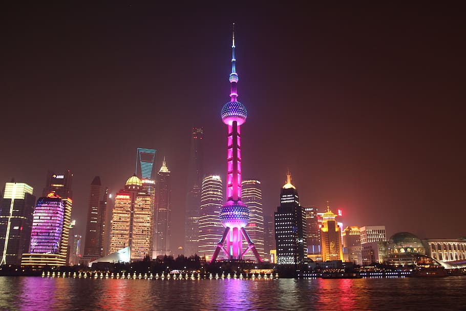 lighted city buildings near body of water, shanghai bund night