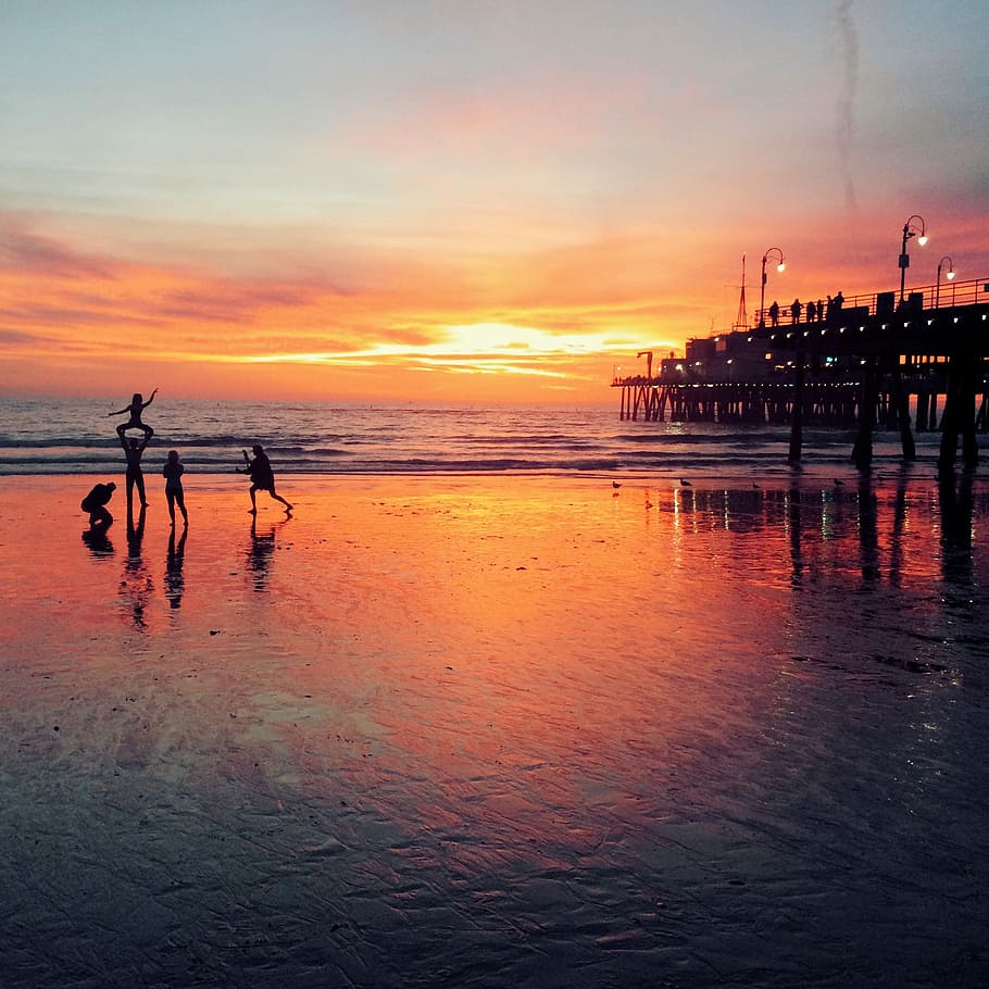 body of water during sunset, pier, nature, beach, people, sky HD wallpaper