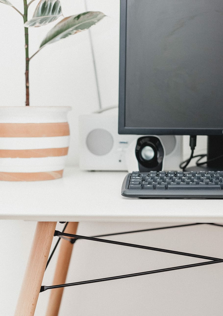 flat screen computer monitor, keyboard, and pair of speakers on wooden table, black computer keyboard on white wooden table HD wallpaper