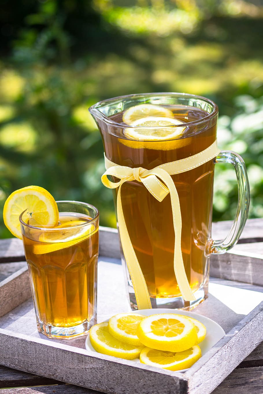 clear glass pitcher with tea inside during daytime, ice tea HD wallpaper