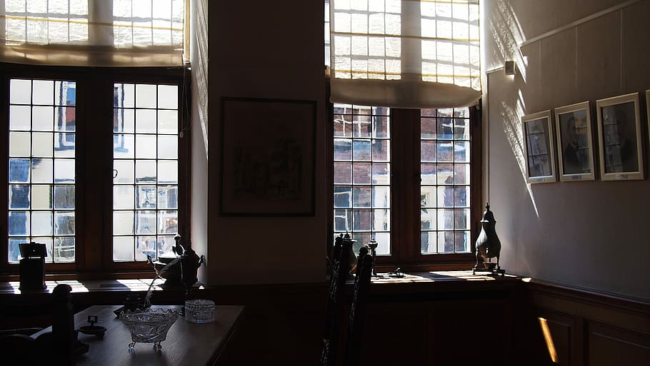 sun rays through the closed window of building, brown wooden table near window pane at daytime in room HD wallpaper