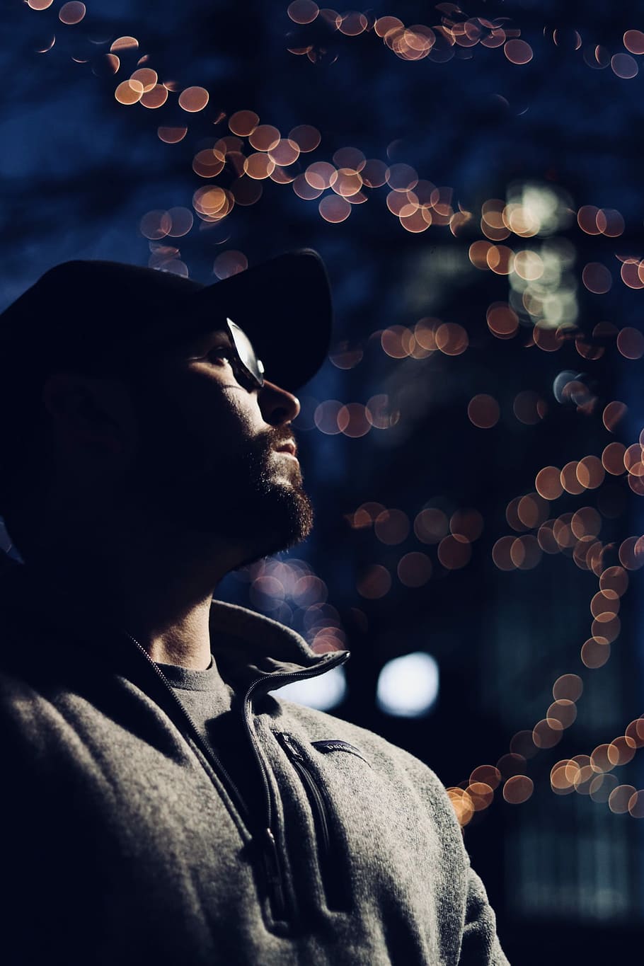 Lost in City lights, tilt shift photography of man in gray jacket HD wallpaper