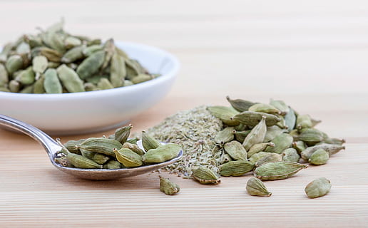 hd wallpaper selected focus photo of green seeds on brown surface cardamom wallpaper flare green seeds on brown surface cardamom