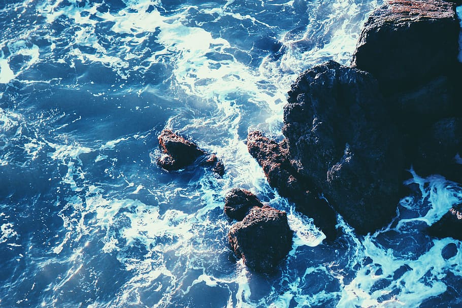 aerial photo of rock formation on body of wate, sea, brown HD wallpaper