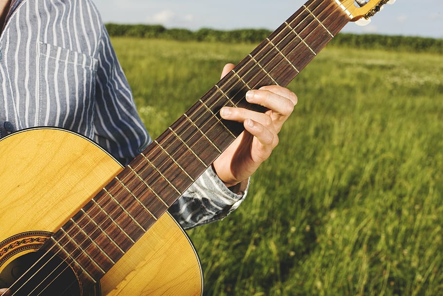 person playing brown acoustic guitar, classical guitar, guitar player