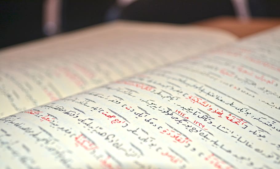 opened book with handwriting, quran, arabic, islam, text, selective focus