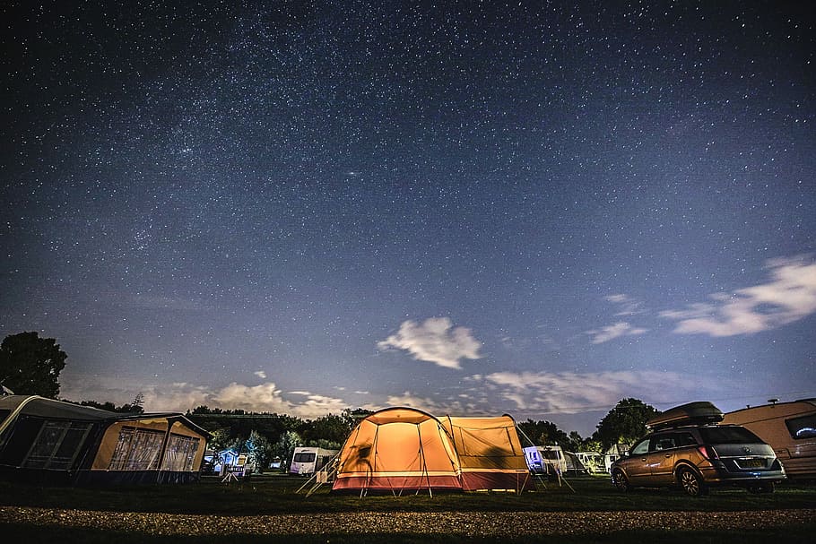 orange tent near parked minivan, photo of camping tent on parking area during nighttime HD wallpaper