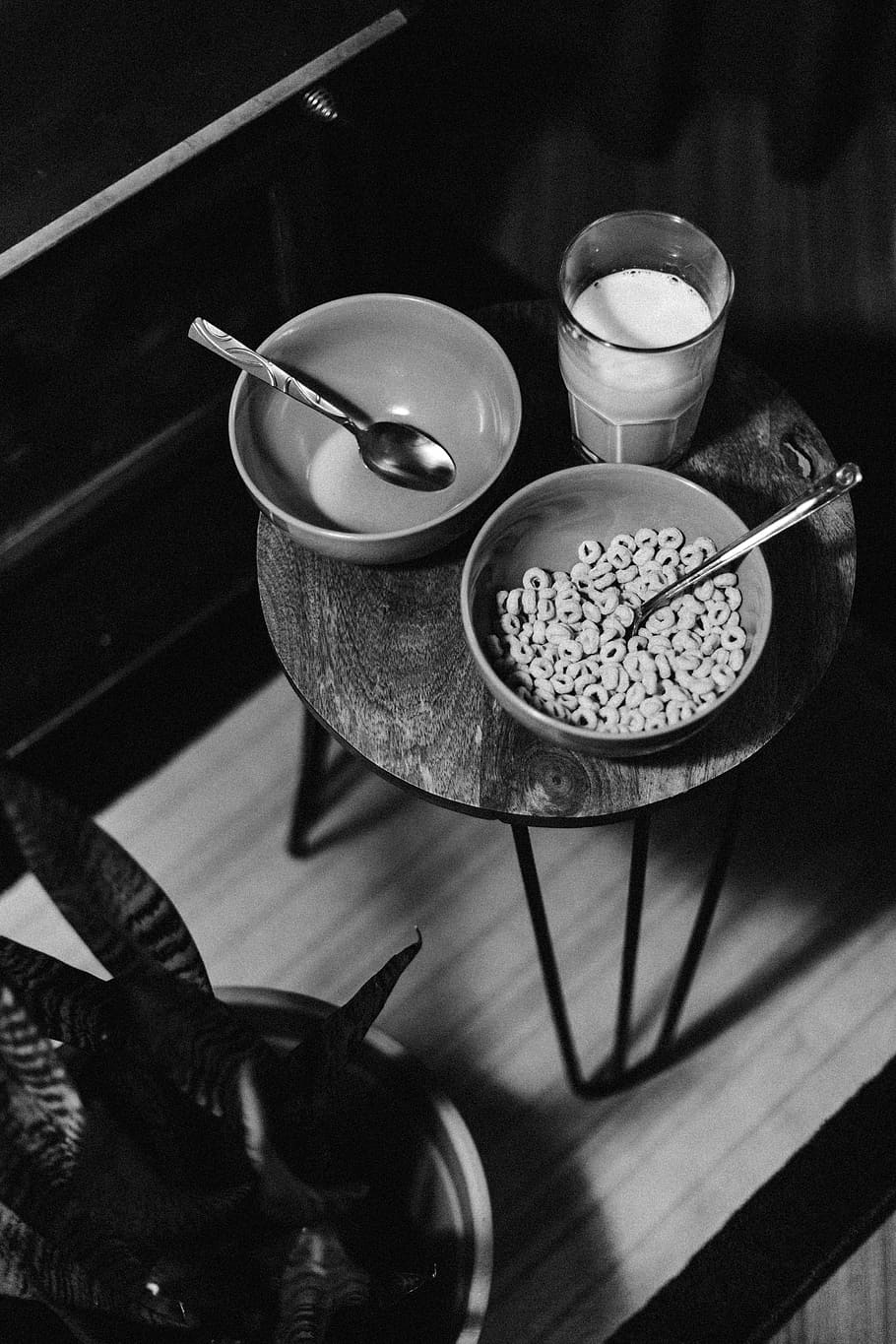 grayscale photo of bowl of cereal beside glass of milk, grayscale photography of cereals and milk on table