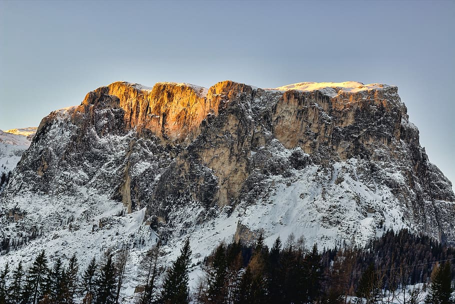 snow-capped mountain range under sky, trees near mountain at daytime HD wallpaper