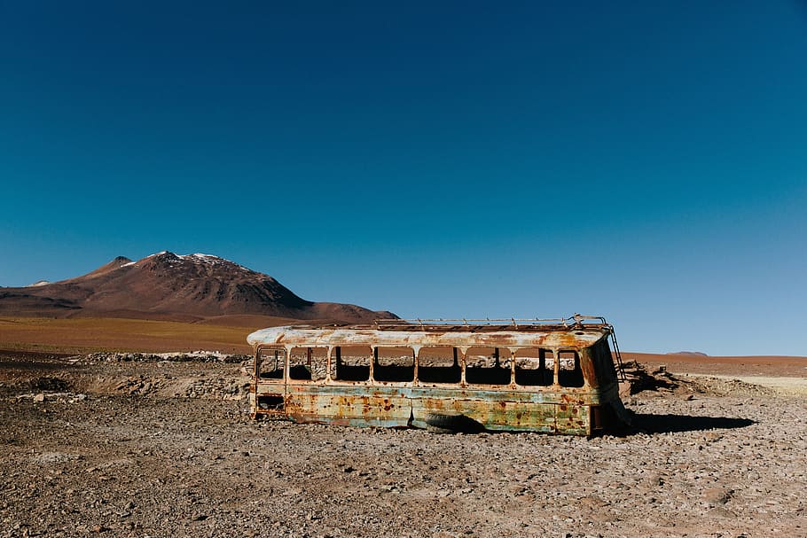 brown bus on brown soil under blue sky, desert, sand, rocks HD wallpaper
