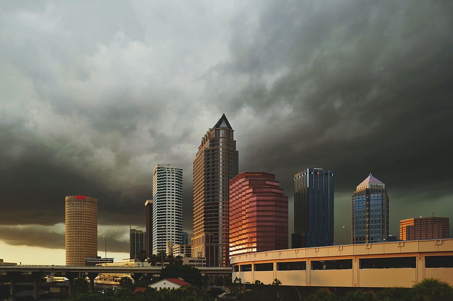 high-rise buildings under black and white clouds, architecture HD wallpaper
