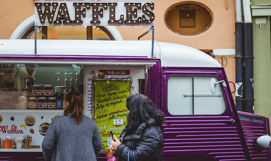 two women near purple and white waffle van with store at daytime, two women standing in front of waffles food truck HD wallpaper