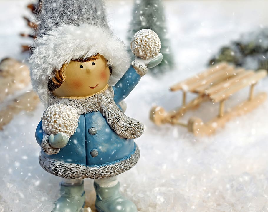 boy figurine focus photo, girl, figure, snow ball, throw, snowflakes HD wallpaper
