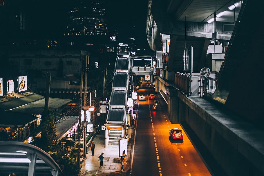 high-angle architectural photography of concrete structure with road on bottom during nighttime, photo of cars travelling on road during nighttime HD wallpaper