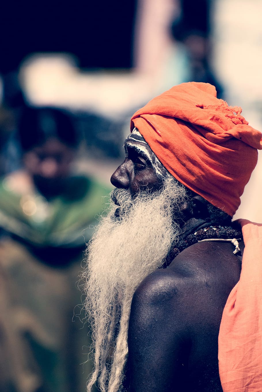 Sadhu in Madurai, selective focus photo of long bearded man wearing orange turban
