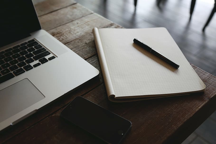 MacBook Pro on brown table, black, ball, pen, top, white, laptop HD wallpaper