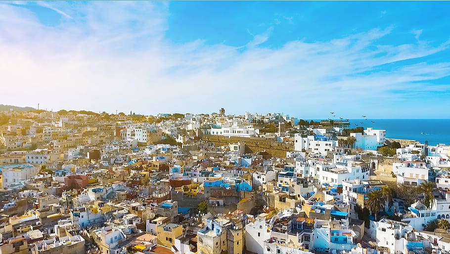 areal view of white and blue houses, aerial-view of city buildings under cloudy sky HD wallpaper