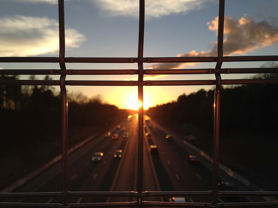 cars on street road during sunset, bars, fence, highway, traffic HD wallpaper