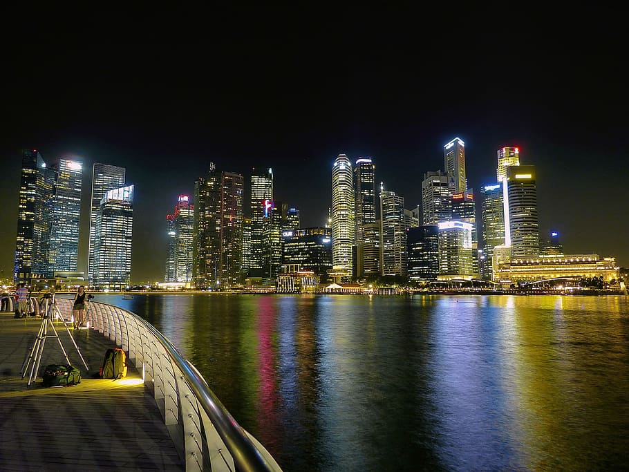 lighted city building near body of water, night, cityscape, urban Skyline HD wallpaper