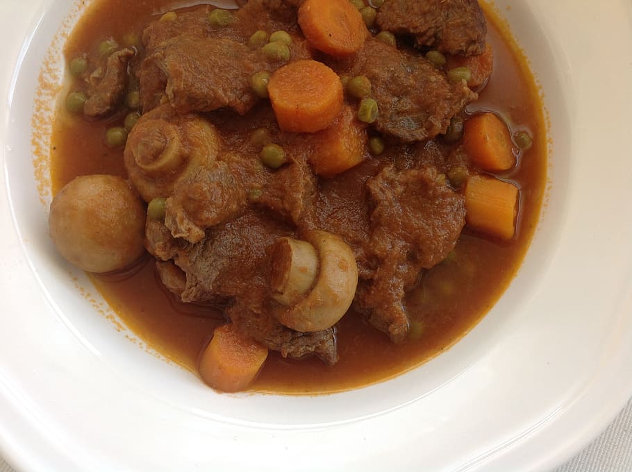 meat dish with mushrooms and carrots on white ceramic bowl HD wallpaper