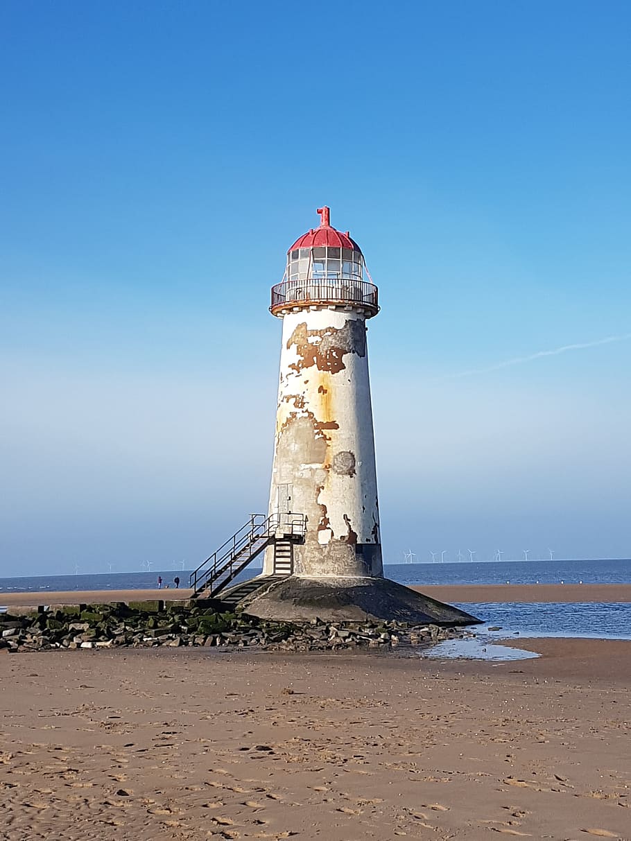 lighthouse, sea, seashore, beach, ocean, water, sky, land, tower HD wallpaper