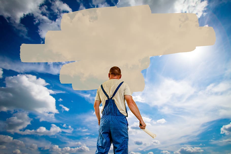 man holding pain roller with sky and clouds background, house painter HD wallpaper