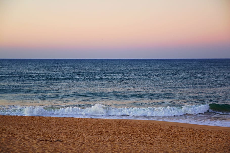 ocean waves during sunset, faro, portugal, atlantic, algarve