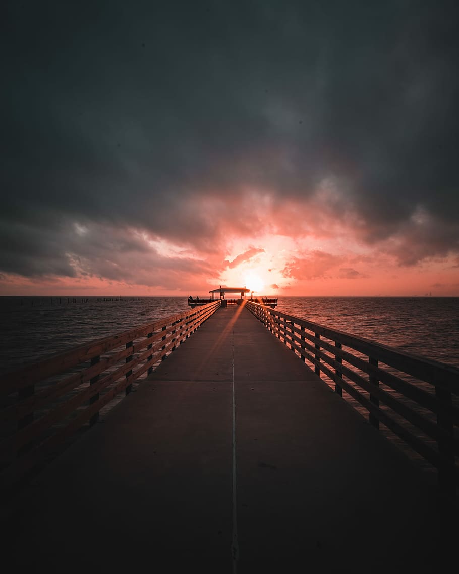 brown dock surrounded by body of water during golden hour, brown bridge on ocean HD wallpaper
