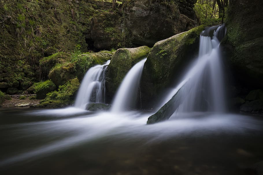 flowing water near forest and mountain during daytime, closeup photography of green mountain and falls HD wallpaper