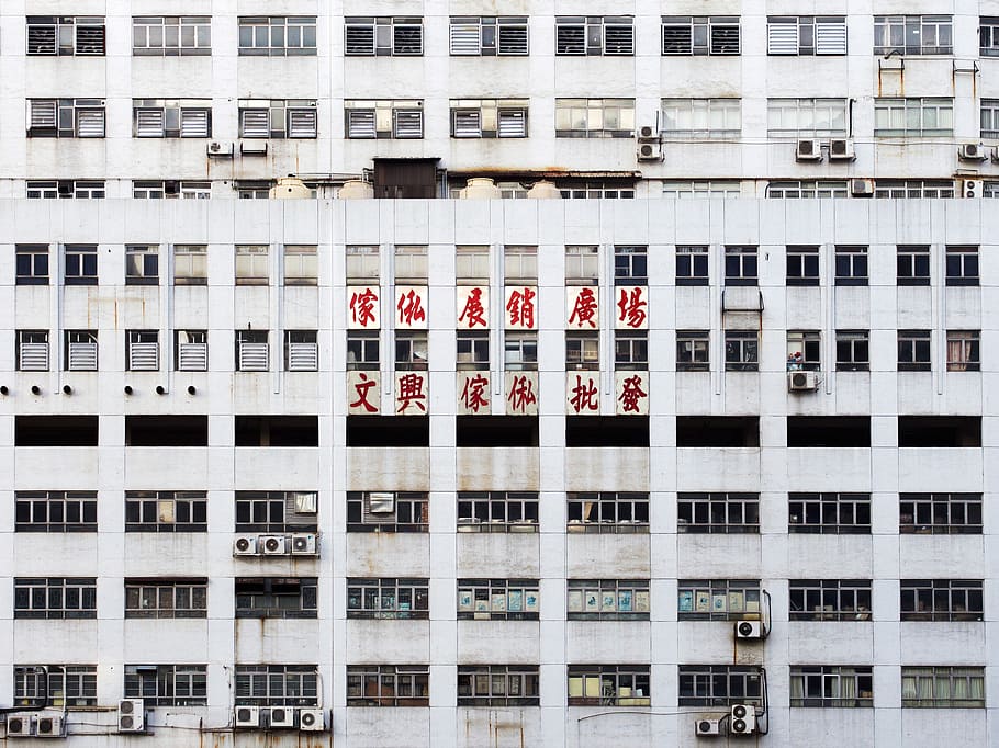 gray multistory building with red Oriental script signage, white concrete high-rise building at daytime HD wallpaper