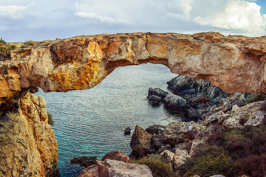 high angle photography of rocky shore, cyprus, cavo greko, korakas bridge