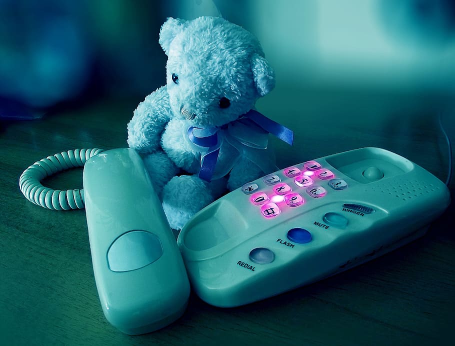 gray teddy bear and white home telephone on brown surface, Sorrow