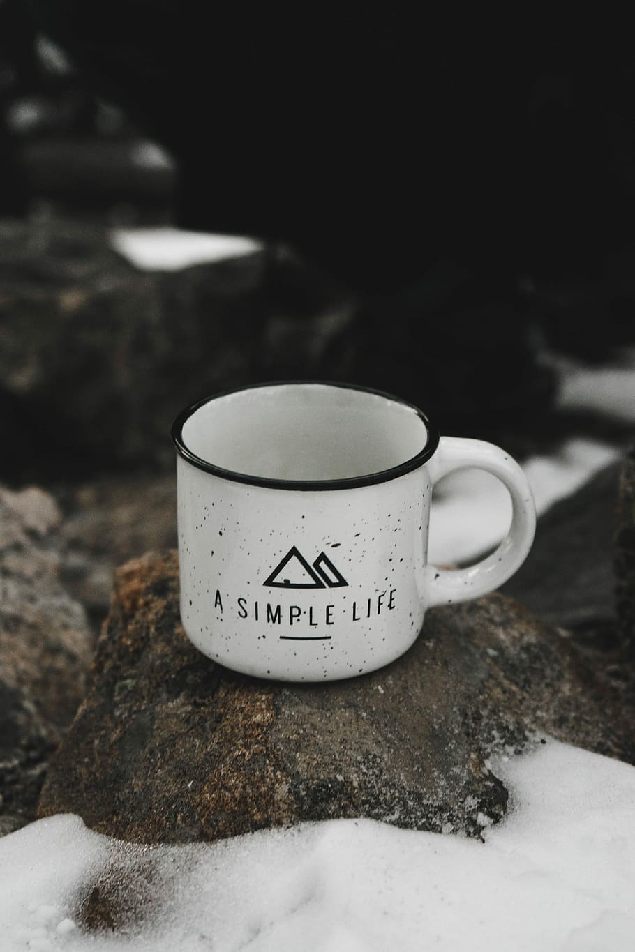 white ceramic mug on rack, closeup photo of black and white a simple life text-printed mug on brown rock HD wallpaper