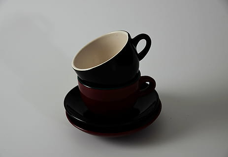 two black and brown ceramic cups, tea, saucer, red, white, kitchen HD wallpaper