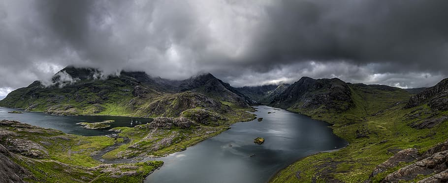 body of water hear mountain, aerial shot of mountains and body of water under cumulus clouds HD wallpaper