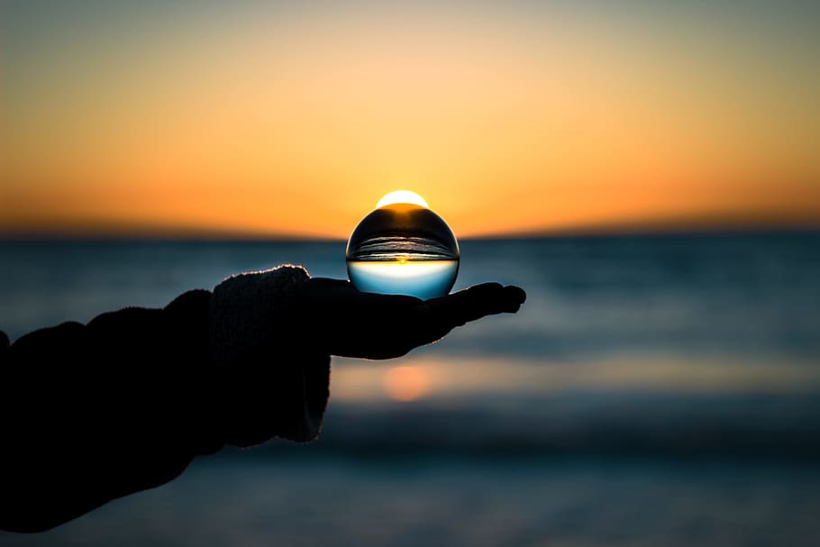 The Second Sunrise., silhouette photo of person holding glass ball, HD wallpaper