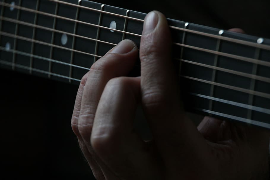 person holding guitar strings, finger, hand, playing, instrument HD wallpaper