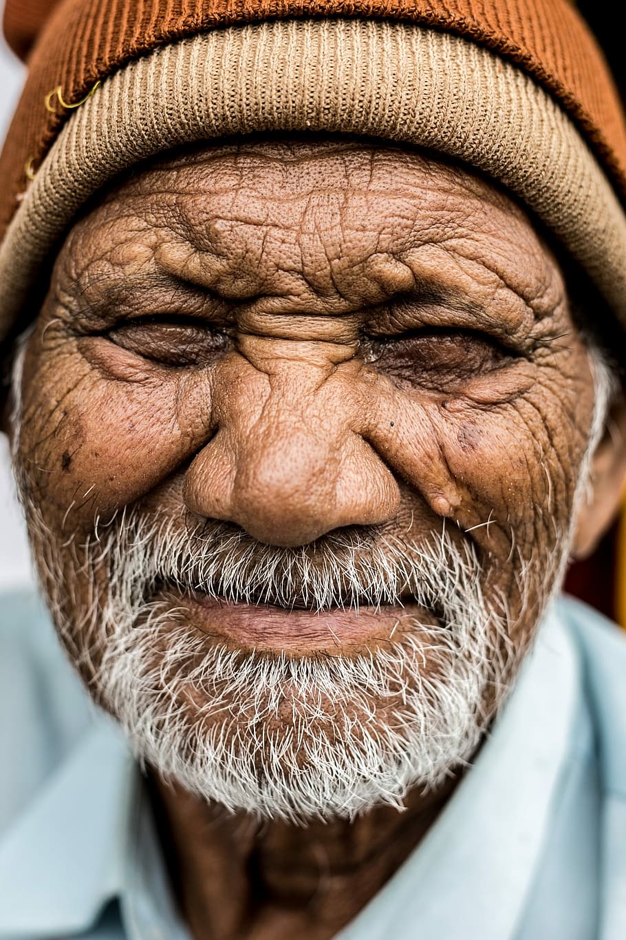 man wearing brown knit cap close up photo, senior Adult, men