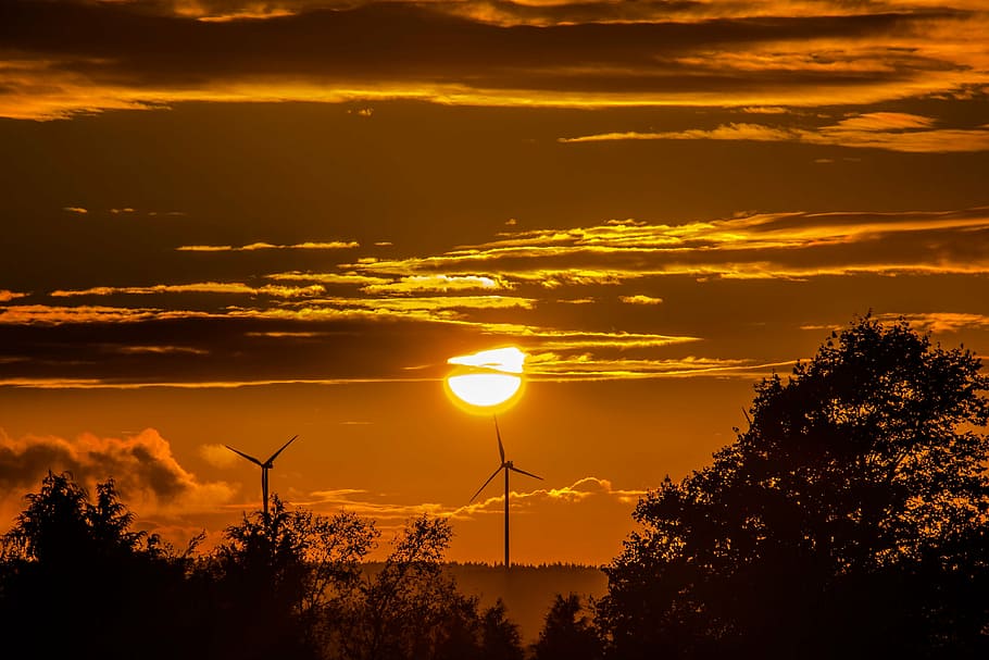 two windmill turbines under clouds golden hour photography HD wallpaper