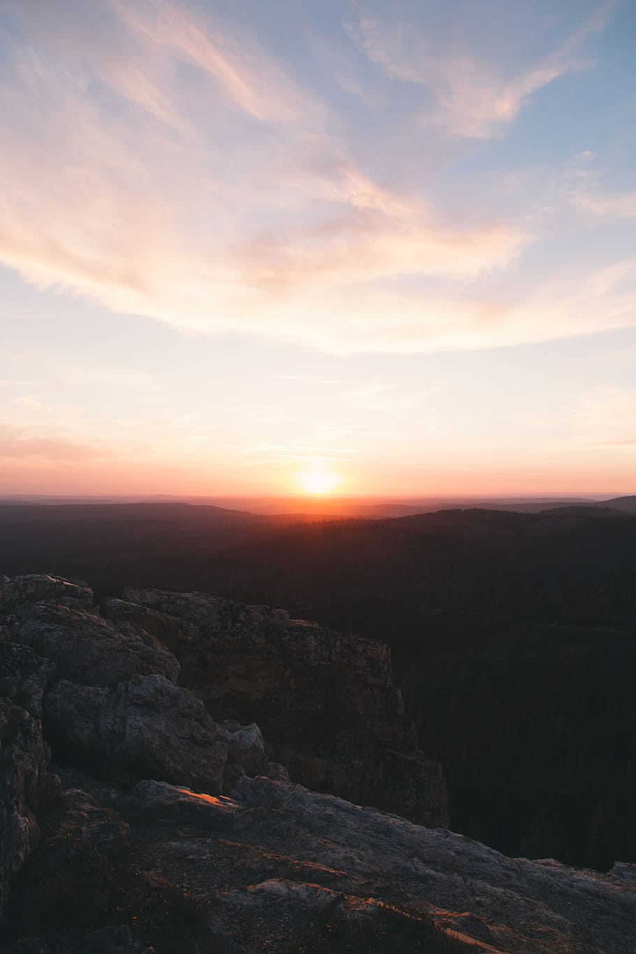 skyline photography of sunset above the horizon, aerial photo of rocky mountains during sunset HD wallpaper