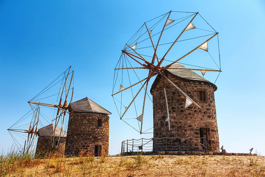 three brown windmills on hill, three brown windmills under blue sky HD wallpaper