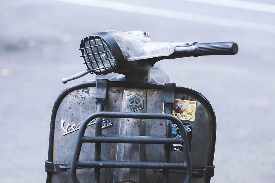 selective photo of gray motor scooter, vespa, italian, motorcycle