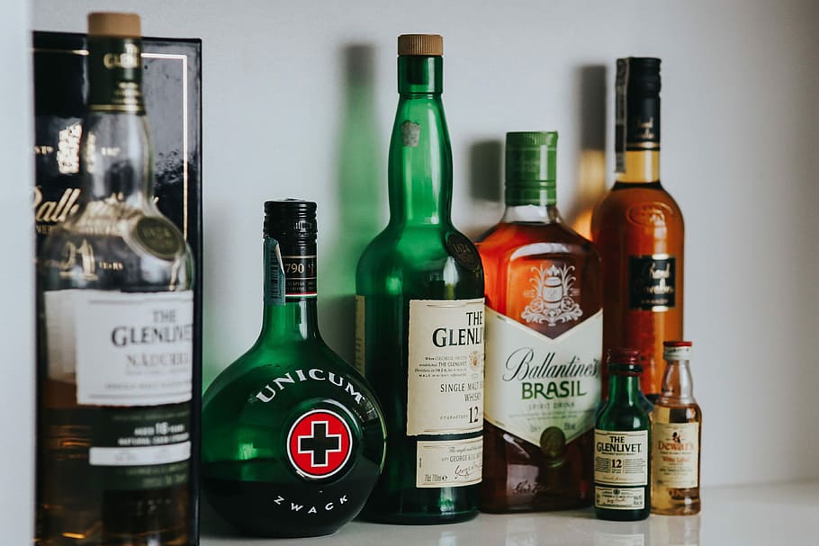Bottles with liquor, alcohol, unicum, ballantines, glenlivet