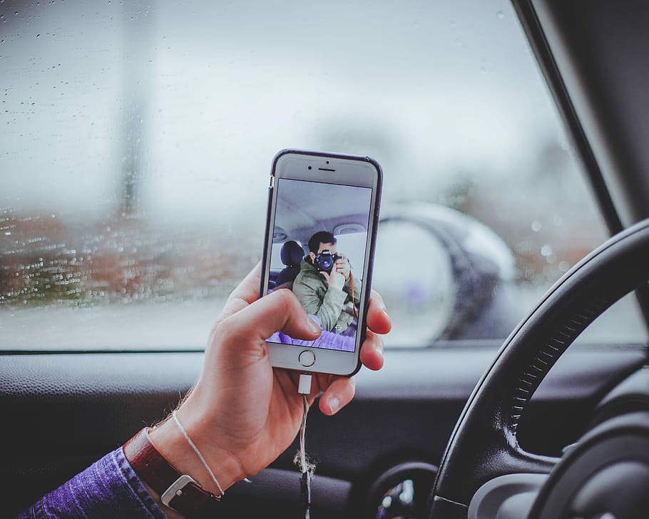HD wallpaper: person taking selfie inside the car, person inside vehicle  using iPhone | Wallpaper Flare